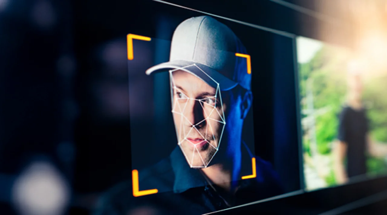 Face of a man wearing a baseball cap being analyzed by facial recognition software