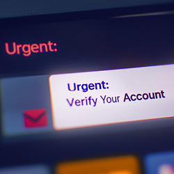 Close-up of a screen showing a message with the subject &ldquo;Urgent: Verify Your Account&rdquo;